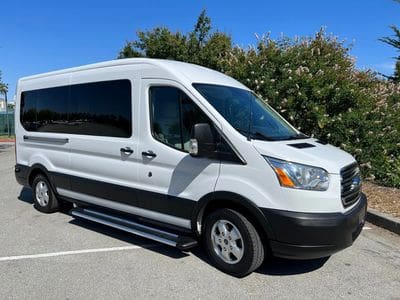 A white van parked in the parking lot.