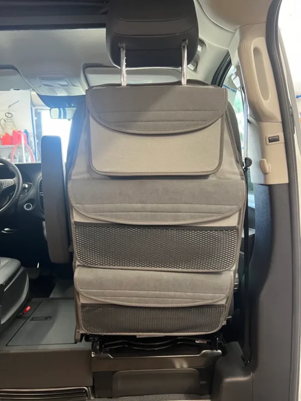 A car seat with the back seats folded down.