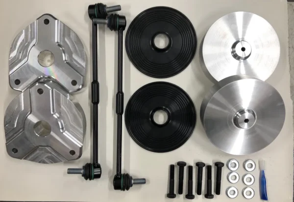 A table with some parts of the car and wheels