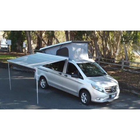 A car with an awning attached to the back of it.