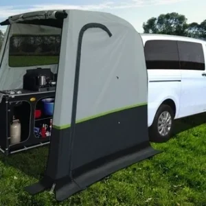 A van with an awning attached to it's back.