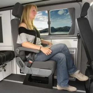 A woman sitting in the back of an rv.