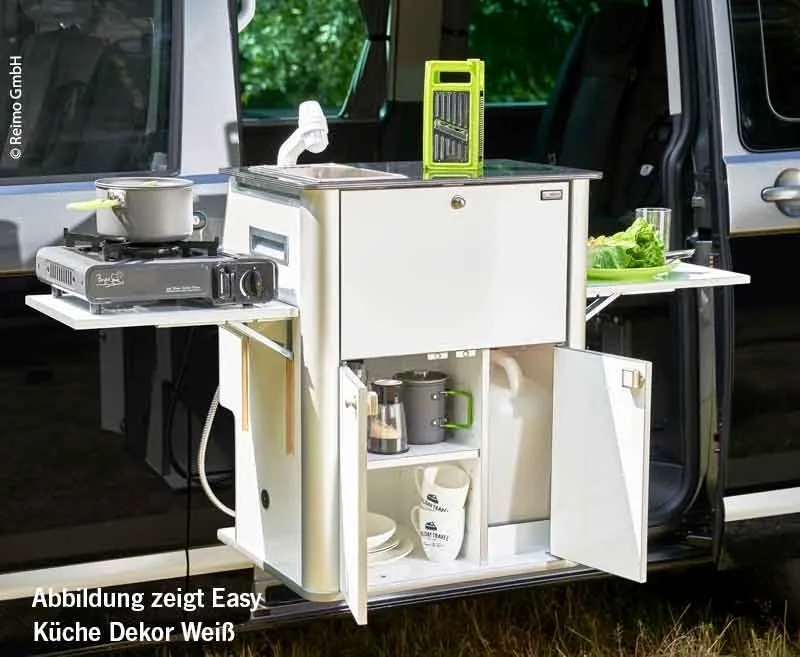 A white cabinet with a green handle and a cup holder.