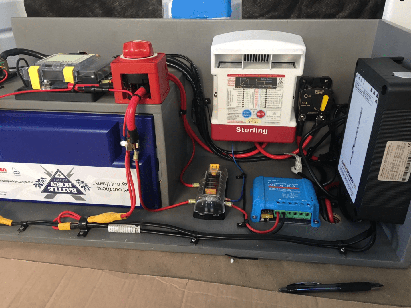 A table with many different electrical equipment on it.