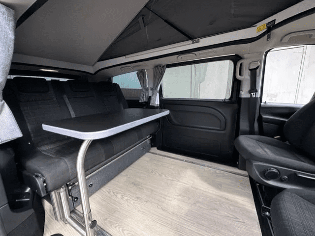 A small van with the back seats folded down.